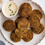 Close-up of golden baked falafel showing crispy edges and herb-filled texture.