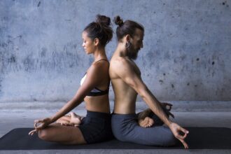 Valentine’s Day: How couples yoga helps to relieve stress in your relationship