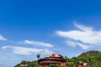 Eden Rock hotel perched on volcanic rock at St. Jean Beach, St. Barths, with crystal clear turquoise water